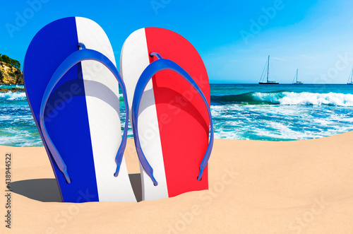 Flip flops with French flag on the beach. France resorts  vacation  tours  travel packages concept. 3D rendering