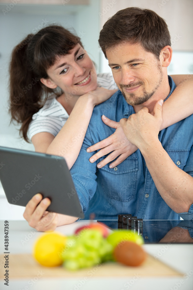 adult couple cooking together at home