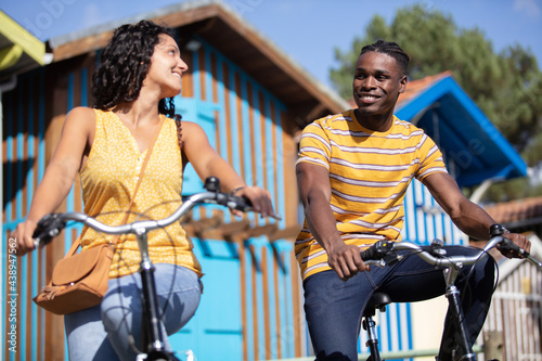 two friends riding on bikes in the countryside