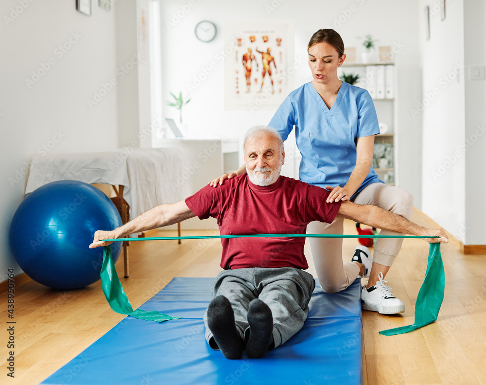 nurse doctor senior care exercise physical therapy exercising help assistence retirement home physiotherapy strech band clinic therapist elderly man nurse doctor senior care exercise physical therapy exercising help assistence retirement home physiotherapy strech band clinic therapist elderly man