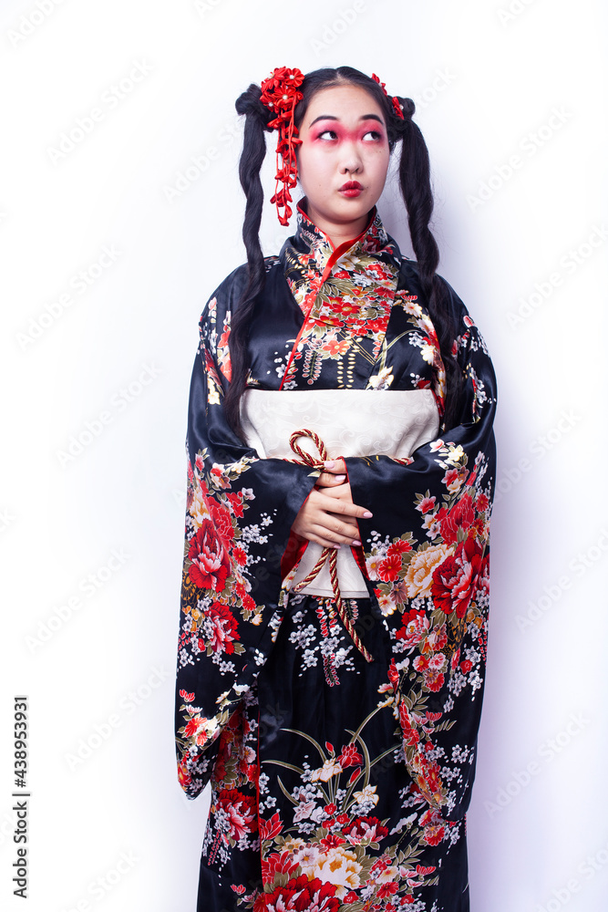 young pretty geisha in black kimono with sakura, asian ethno closeup on white background isolated young pretty geisha in black kimono with sakura, asian ethno closeup on white background isolated