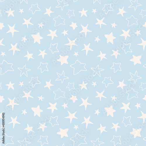 Cute bright doodle stars seamless pattern. Hand drawn night sky repeat background in pastel blue color. For fabric, wrapping, invitations, card, scrapbooking or wallpaper.