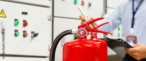 Fire extinguisher, Firefighter use inspection list checking pressure gauge level of fire extinguisher tank in the building of protection and prevent for emergency and safety rescue and fire training.