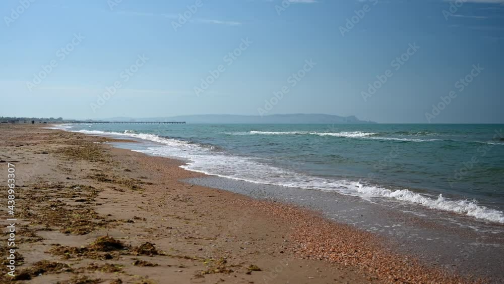 Coastline against the blue sea with yellow sand. Coastline against the blue sea with yellow sand.