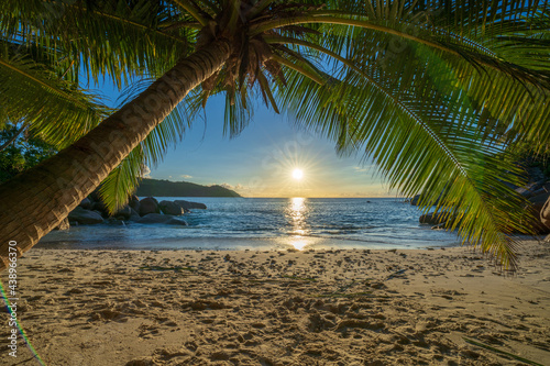 sunset at tropical beach anse lazio on praslin on the seychelles