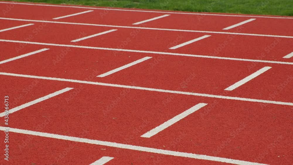Red running track on stadium Red running track on stadium