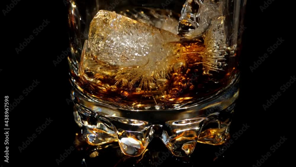 Pouring coke in glass with ice Pouring coke in glass with ice