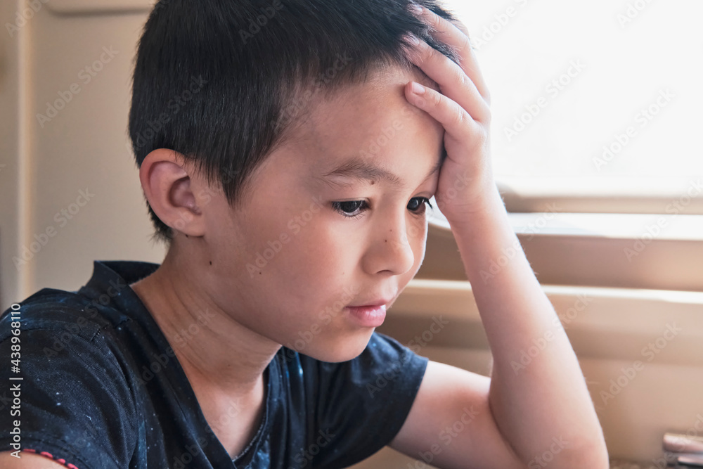 Close-up portrait of young asian thinking boy Close-up portrait of young asian thinking boy