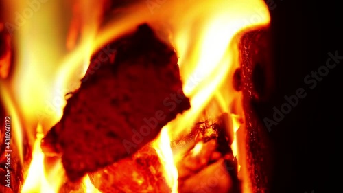 Time lapse of burning firewood in a stove