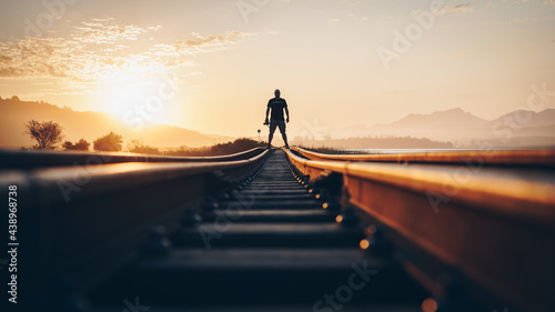Silhouette of a person on a bridge at sunset 3