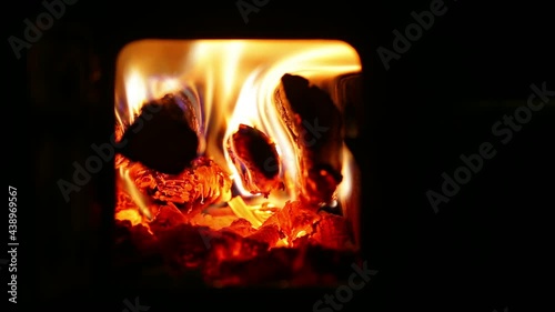 Time lapse of burning firewood in a stove