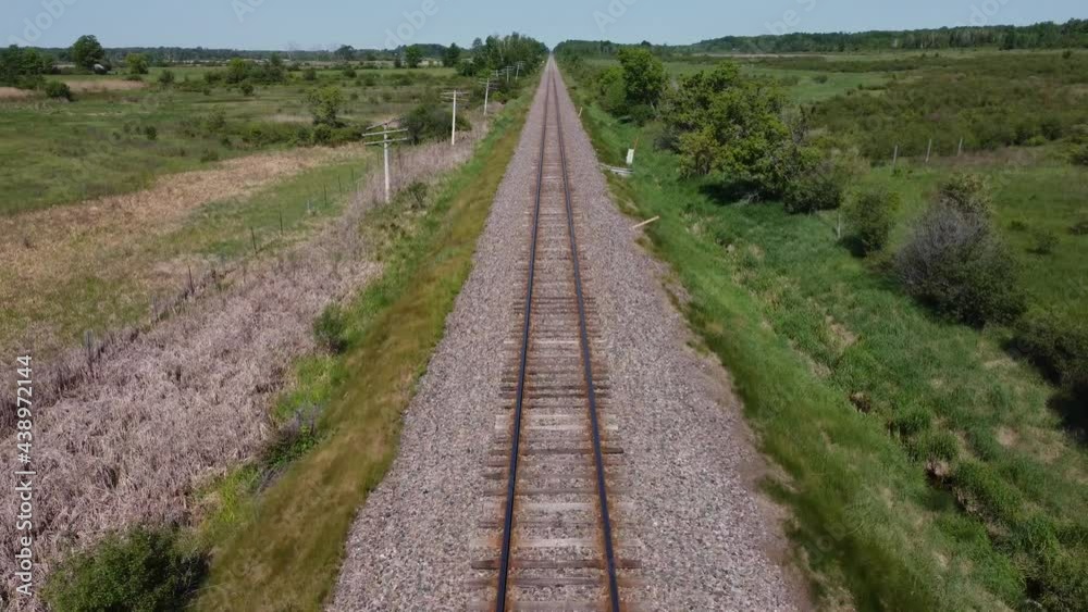 Bird's eye view travelling down train tracks, aerial drone shot. Bird's eye view travelling down train tracks, aerial drone shot.