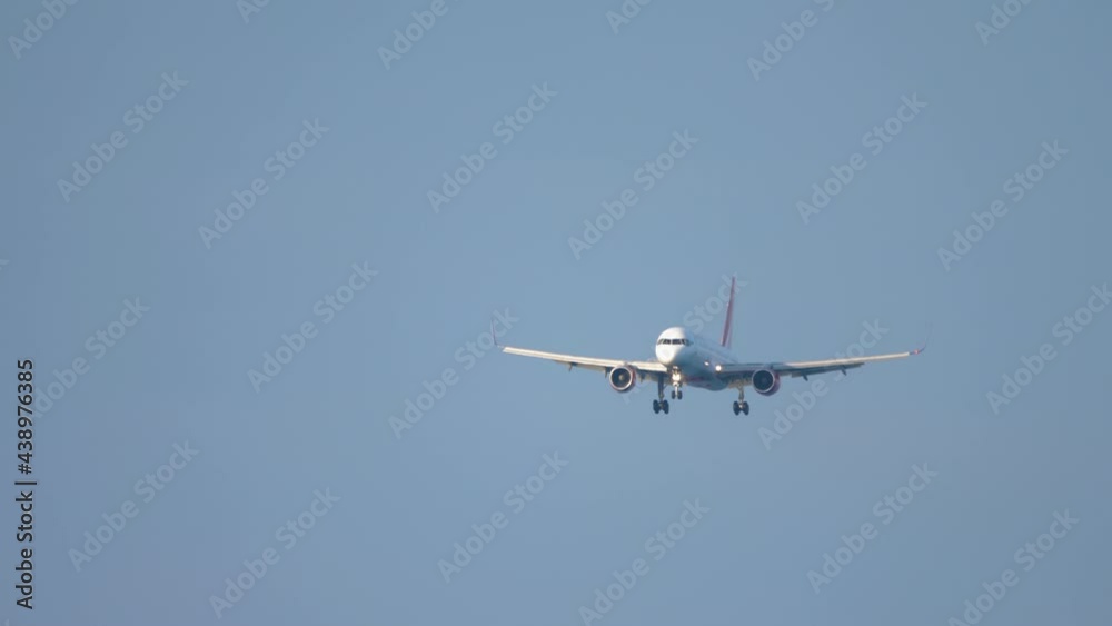Passenger plane descends for landing Passenger plane descends for landing