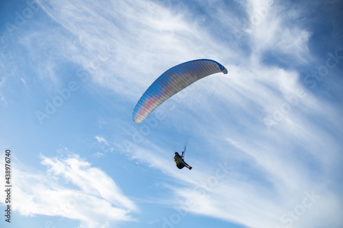 Paragliding over sea with beautiful blue sky background at Phuket,Thailand. soft socus.