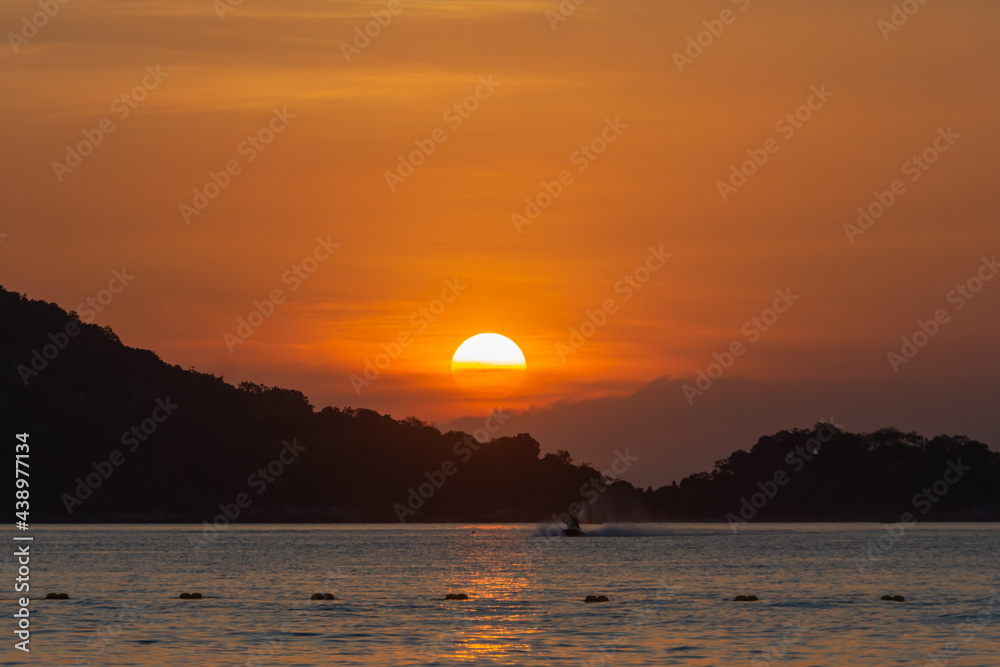 beautiful sunset at Patong beach, Phuket, Thailand. soft focus and noise.