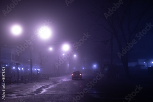 night city street alone car winter season.