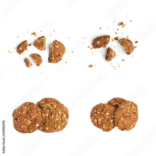Oatmeal cookies with raisins and coconut on a white background. View from the top.