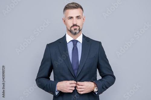 confident businessman man in businesslike suit, charisma