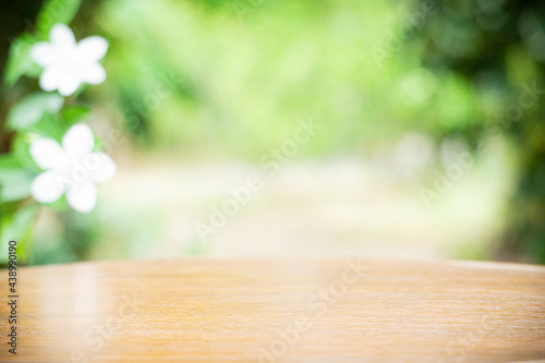 Wood table top on blur garden background