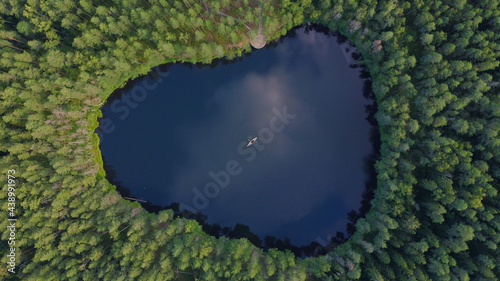 An areal shot of a lake in the woods