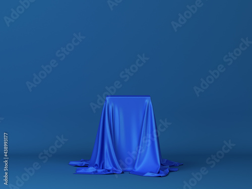 Cube covered with piece of cloth