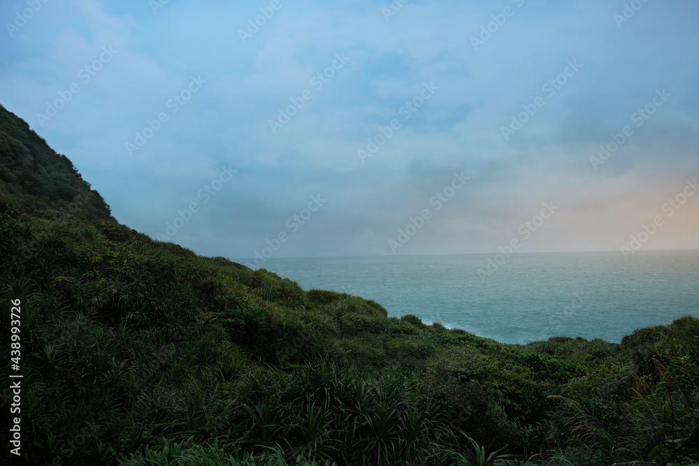 High cliff mountain and sea offshore