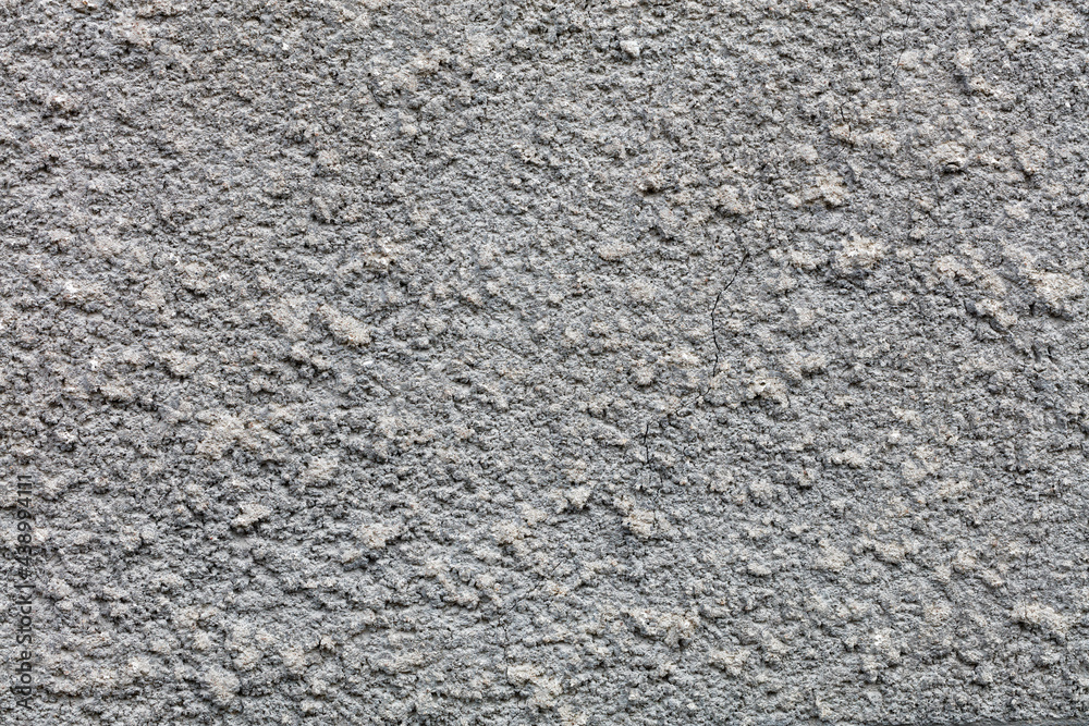 Texture and background of a gray textured wall covered with a cement coat. Texture and background of a gray textured wall covered with a cement coat.