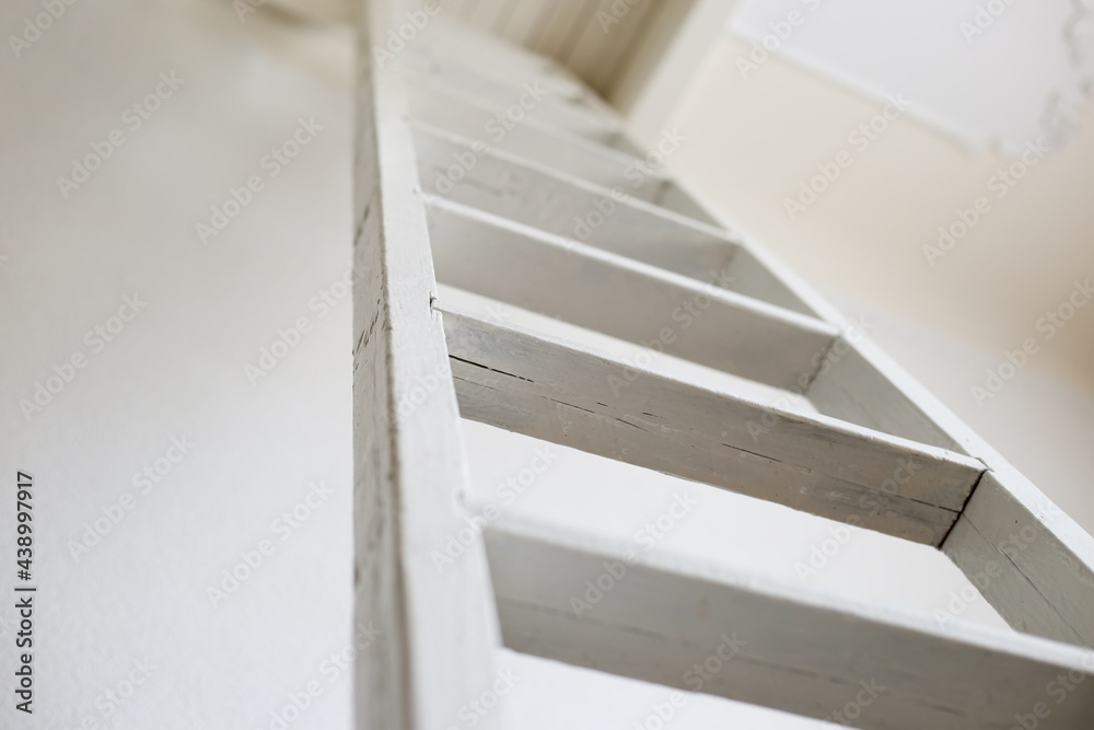 White wooden staircase close-up.