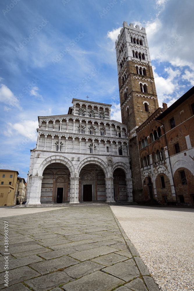 view of the cathedral of Lucca, famous town in the countryside of tuscany (Italy). The church and the square are dedicated to saint martin of tours