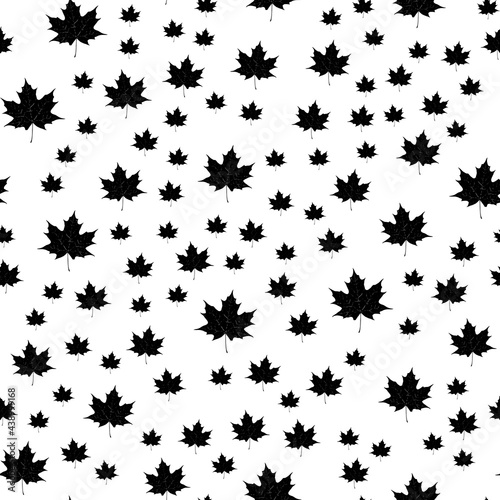 Seamless vector pattern of maple leaves. On a white background.