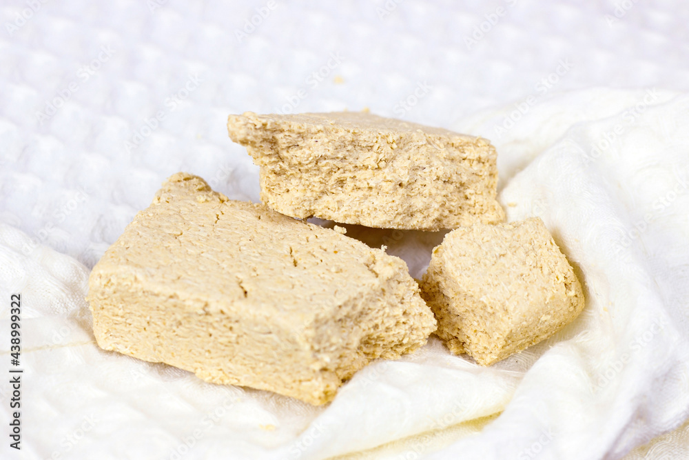 Traditional sweet turkish delight halva pieces on light background.