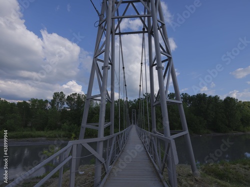 steel bridge over mountain river