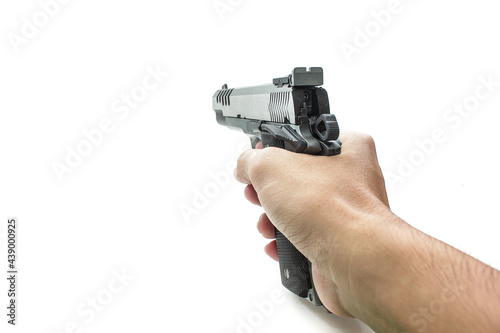Hand holding pistol handgun isolated on white background