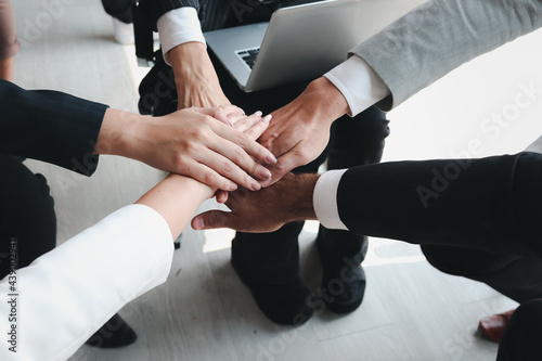 Wallpaper Mural businessman and woman putting hands join together, business partnership colleagues holding hands as commitment of strong team work, unity and teamwork join hands support concept Torontodigital.ca