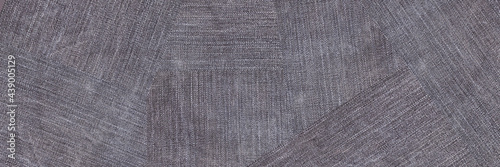 A denim gray jean closeup, banner with space for text. View of old jeans details. Denim background, texture