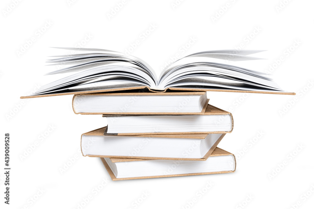Fototapeta premium Open book lying on high stack of books isolated on white background