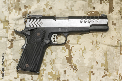 M1911 pistol weapon on Marine Desert camo photo