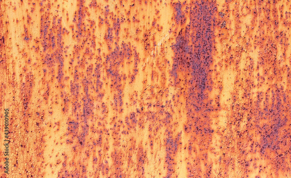 Abstract background of metal rusty wall with peeling paint