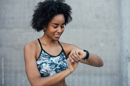 Bilde på lerret Fitness woman checking time on smart watch.