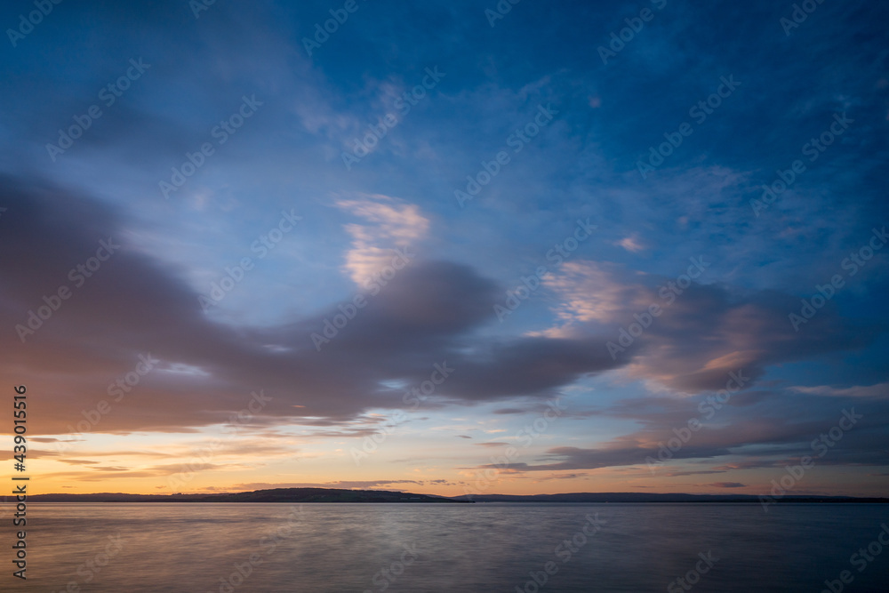 Cloudscape above Helgøya Island in Lake Mjøsa at evening.