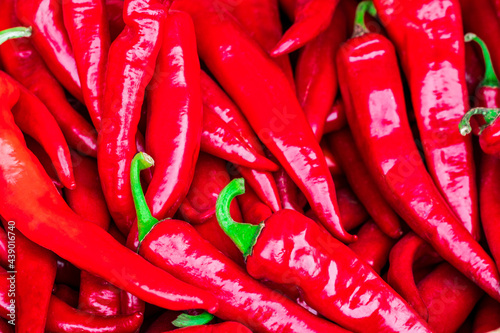 Red hot chilli peppers pattern texture background. Close up. Landscape. A backdrop ofRed hot chilli peppers. Street vegetable market. Group of Red hot chilli peppers photo