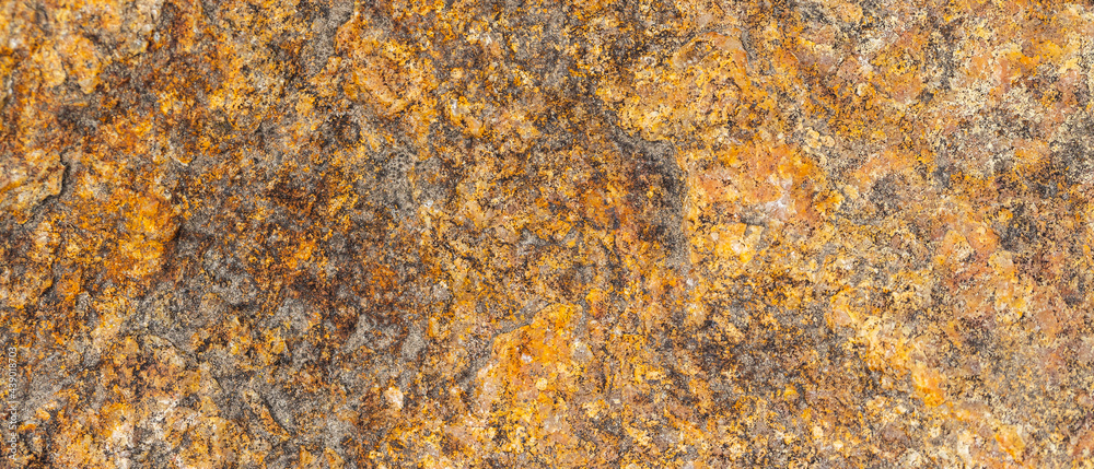 Background of granite. Texture of brown granite stone. Weathered stone surface. Copy space Background of granite. Texture of brown granite stone. Weathered stone surface. Copy space