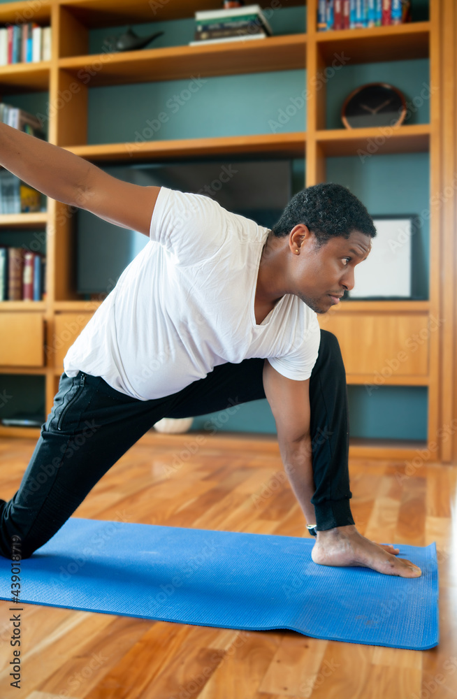 Man doing exercise at home. Man doing exercise at home.