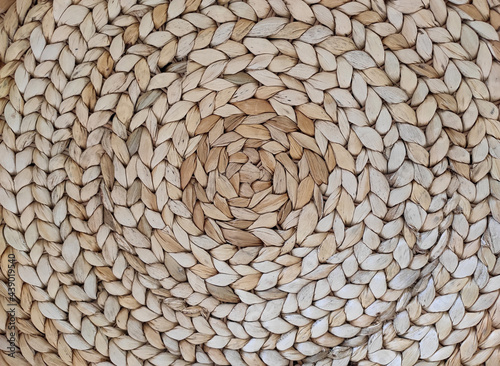 Abstract rattan texture. Background with round large weaving of straw.