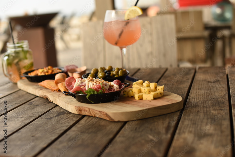 Honest delicacies served as an appetizer on a wooden board