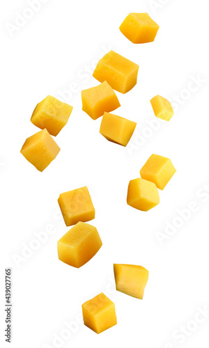 Fényképezés falling mango chunks isolated on a white background