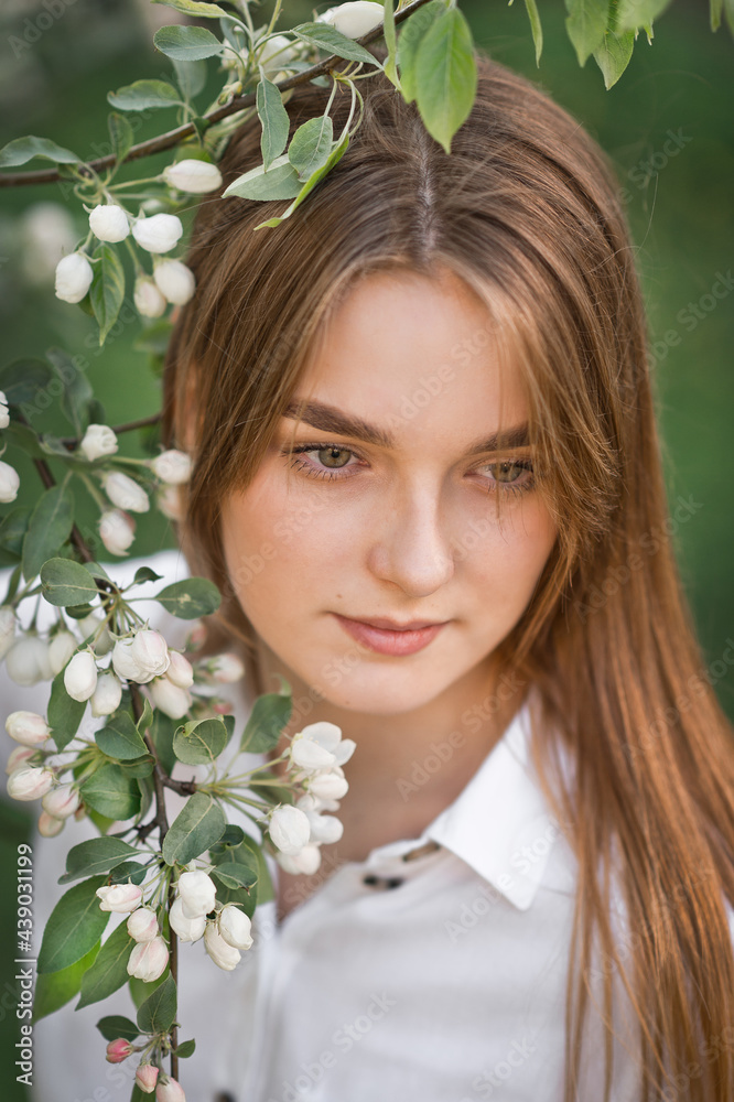 Naklejka premium Portrait of a red-haired beauty in the spring nature 2951.