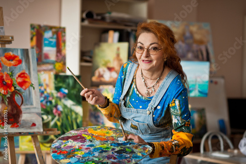 An experienced artist works in her own studio 2902.