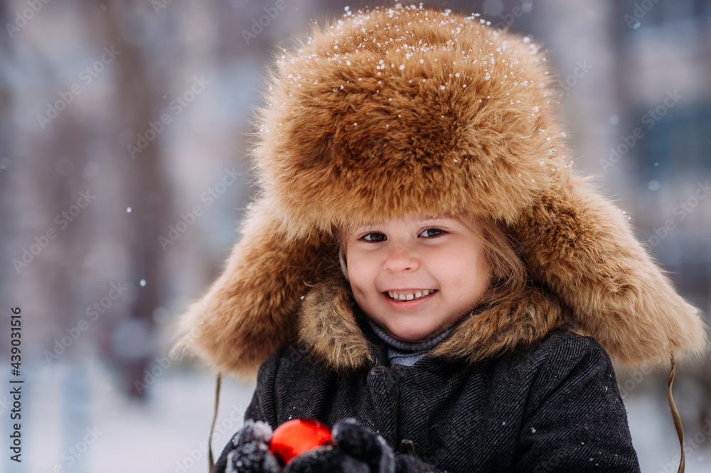 Portrait of a child in a huge winter hat 3132. Portrait of a child in a huge winter hat 3132.