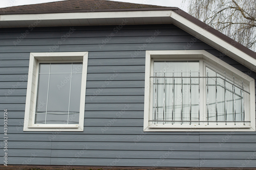 Country house outside the city. Residential building windows.